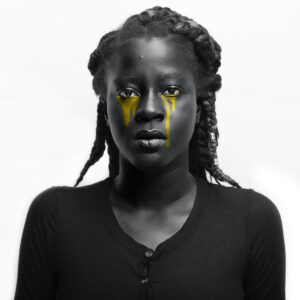 black woman crying yellow tears and sad for racism and mental health