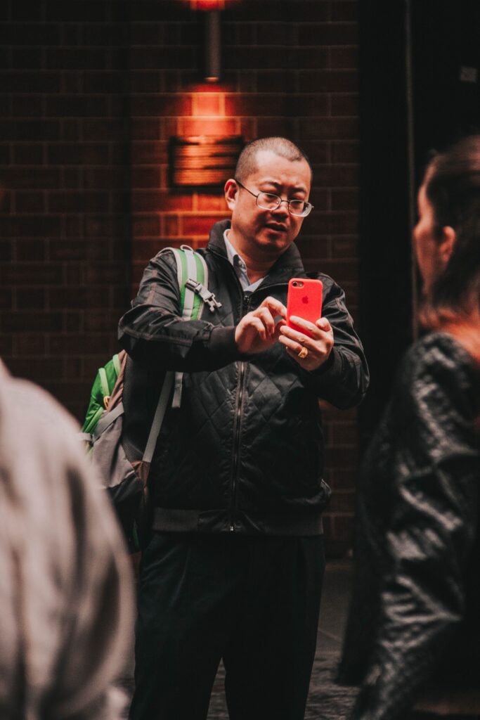 young man on his smartphone taking an image