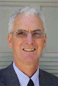 Profile photo of Brian Edmonds wearing a suit and tie