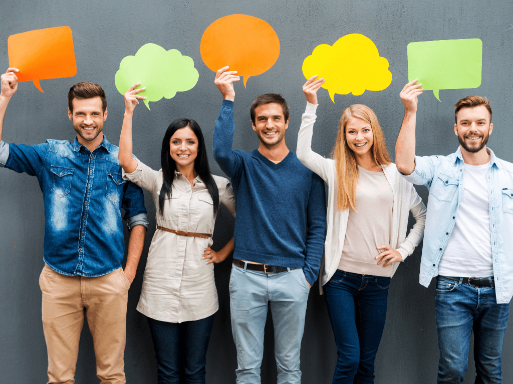 5 people holding blank speech bubbles above their heads